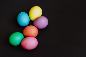 Colored easter eggs on a black background
