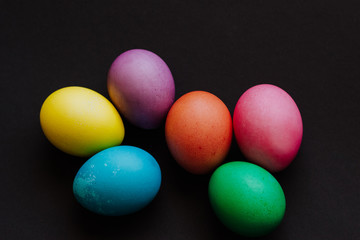 Colored easter eggs on a black background