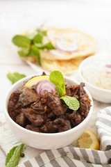 Beef Liver fry or roast served with rice and Roti, selective focus