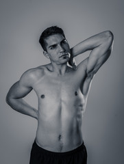 Naklejka premium Body Pain. Strong young man suffering neck and back pain