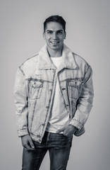 Fototapeta premium Fashion portrait of Attractive young man model posing happy and sexy for the camera