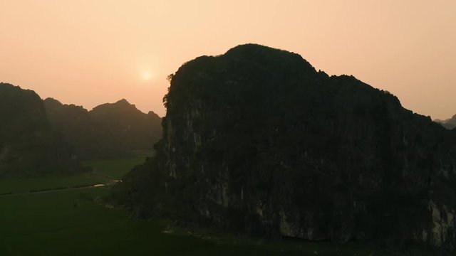 4k Aerial drone footage - Beautiful mountains, jungle, and rice fields of northern Vietnam at sunset.  Asia