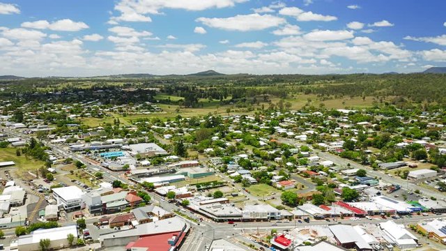 Aerial shot of the town of Beaudesert in the scenic rim region of Queensland Australia. Drone orbits town centre during midday in Summer.