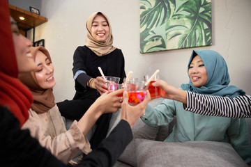 muslim woman quality time with friend having fruit cocktail for break fasting in ramadan together