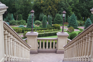 wide view with beautiful classical staircase with balustrade in the park in summet time