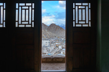 Aerial view of Cityscape Leh city or downtown with mountain background from the window of leh palace at Leh Ladakh, Jammu and Kashmir, India