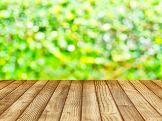Products shelves and advertisements are wooden floors. The background is green from the nature of the tree (blurred image)