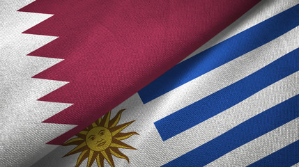 Qatar and Uruguay two flags textile cloth, fabric texture
