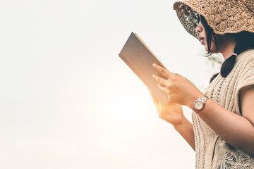 Women tourists read book in the holiday in quiet nature, Concept reading a book.