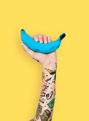 Hand with a blue banana
