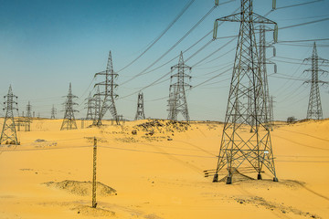Aerial view High voltage metal post. High-voltage tower Top view desert landscape egypt assuan