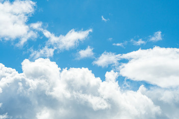 Fototapeta na wymiar thick white cloud under blue sky background