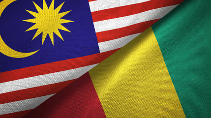 Fototapeta premium Malaysia and Guinea two flags textile cloth, fabric texture