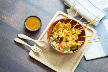 Pork satay, grilled pork served with peanut sauce or sweet and sour sauce.