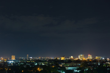Naklejka premium landscape city night with dramatic moody dark sky