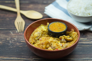 Traditional Thai style omelet with spicy chilli sauce