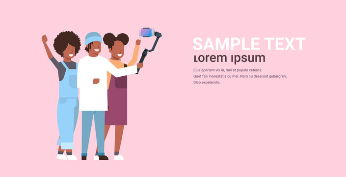 people using 3-axis gimbal stabilizer selfie stick for smartphone happy african american man and women standing together taking photo on smart phone camera horizontal full length