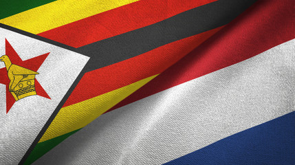 Zimbabwe and Netherlands two flags textile cloth, fabric texture
