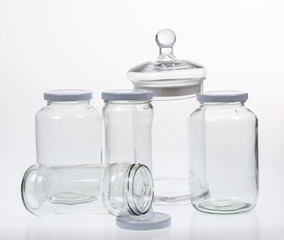 Collection of empty jars on white background with clipping pat