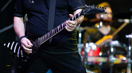 Fototapeta na wymiar guitarist on stage during concert