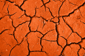 Crackinged land of the red colour in desert