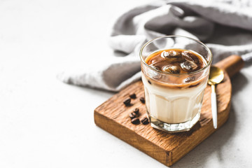 Ice coffee latte, refreshing and energy boost cold drink in glass. Copy space for text