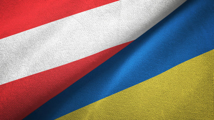 Austria and Ukraine two flags textile cloth, fabric texture
