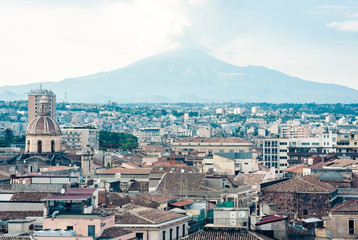 Catania aerial cityscape with Mount Etna, active volcano on the east coast of Sicily, Italy.