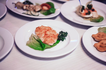 pork chop and lettuce on white plate