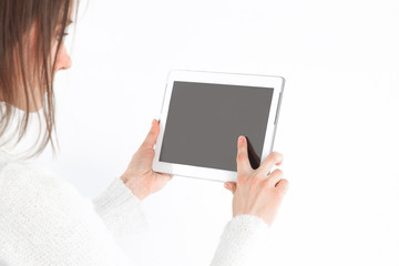 close up. young woman tapping the screen of digital tablet.photo with copy space