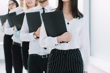 close up.young business people standing in a long line for an interview .