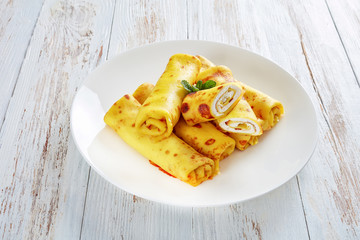 crepes roll up filled with sweet white cheese