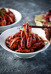 Red spicy crayfish in a white dish