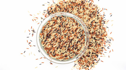 Organic three colors (red, black, and brown) parboiled rice on a white background.