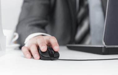 closeup.businessman working on laptop,sitting at his Desk.