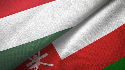 Hungary and Oman two flags textile cloth, fabric texture