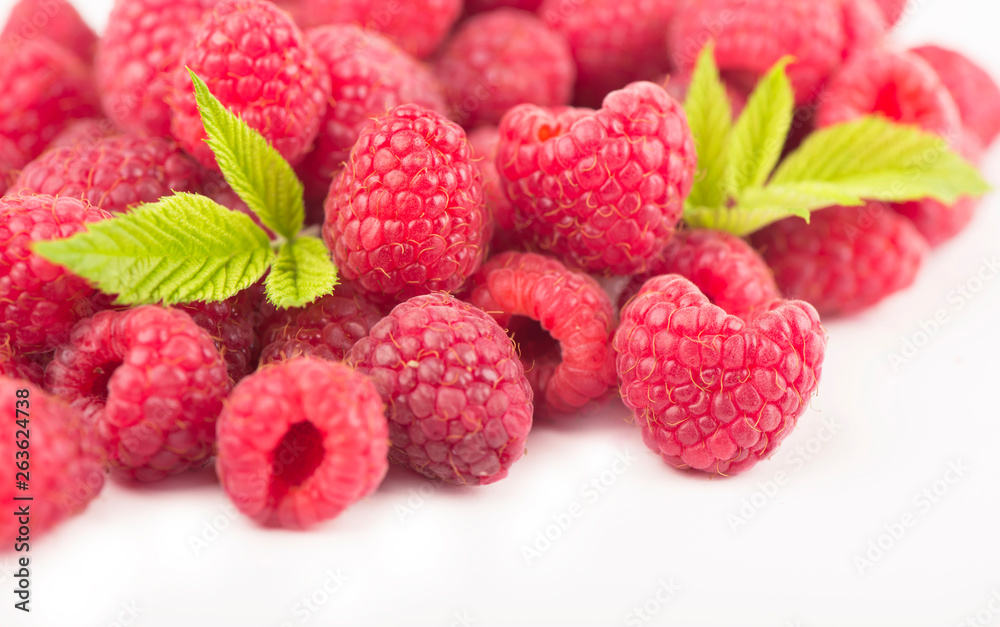 Wall mural Raspberry with leaves isolated on white background