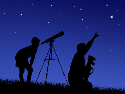 father and son study the starry sky