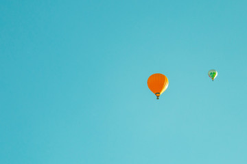 Fototapeta premium Two Air Balloon on High in The Blue Sky Vintage Effect