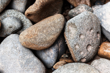 Cobble stones stacked carefully on back beach.