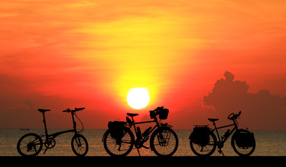 silhouette vintage bike on sunrise