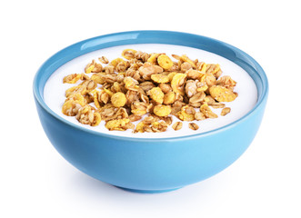 Bowl with oat granola, milk, yogurt isolated on white background.