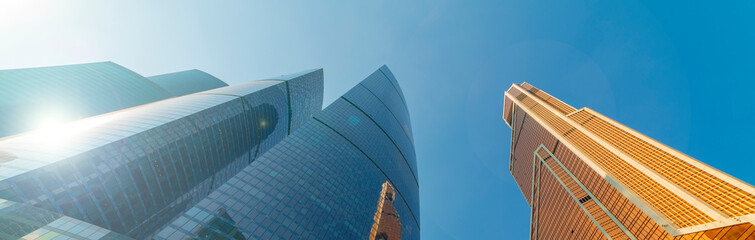 Modern skyscrapers - high-rise buildings in the down town. Bottom view.