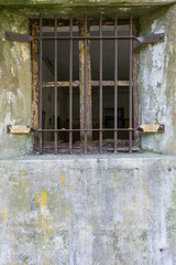 Cement jailhouse window with bars,  vertical