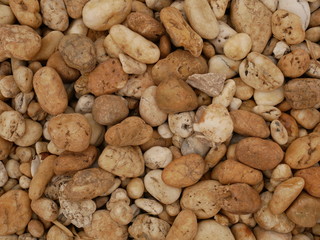 Fototapeta na wymiar brown pebbles stone background