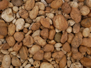 Fototapeta na wymiar brown pebbles stone background