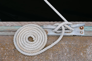 Coiled rope for anchoring a boat on a dock 