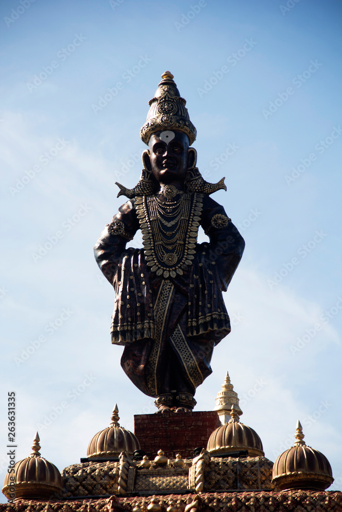 Wall mural standing statue of lord vitthal, close-up, during ganpati festival, pune.