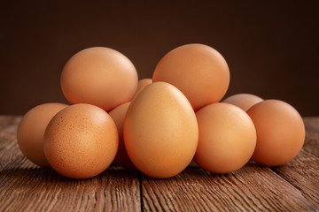 pile of chicken eggs on wooden background
