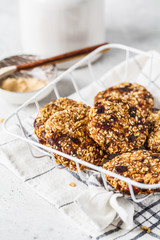 Vegan oatmeal, maca powder cookies with sesame. Healthy vegetarian food concept.